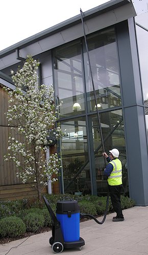 Vacuum cleaning gutters for commercial customers in Brentwood